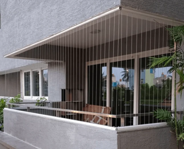 Jay Bhavani Construction team installing an invisible grill on a Mumbai balcony